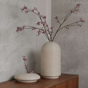 Table with ribbed vases in natural colors