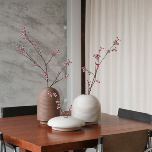 Table with ribbed vases in natural colors