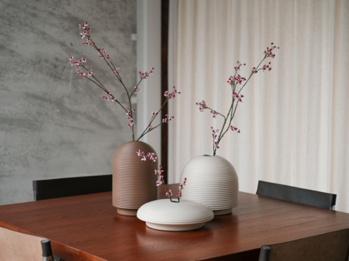Table with ribbed vases in natural colors