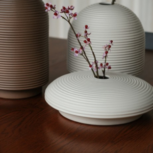 Table with ribbed vases in natural colors