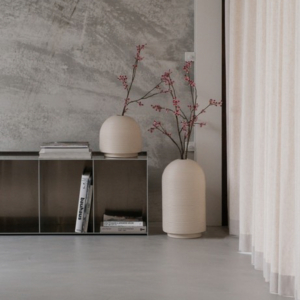 Table with ribbed vases in natural colors