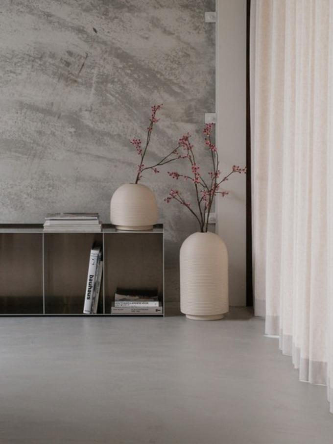 Table with ribbed vases in natural colors