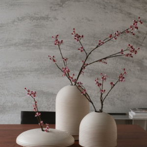 Table with ribbed vases in natural colors
