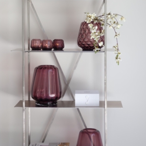 Lifestyle shot for the Kuro collection, showing vases and T-lights in color plum.