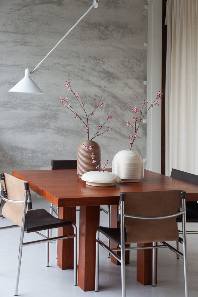 Table with ribbed vases in natural colors