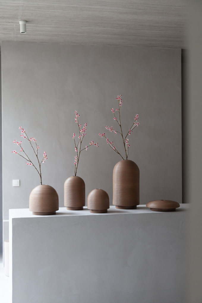 Table with ribbed vases in natural colors