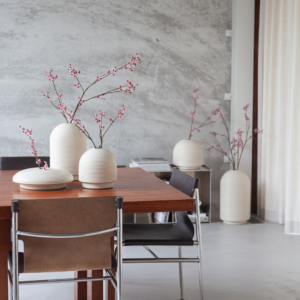 Table with ribbed vases in natural colors