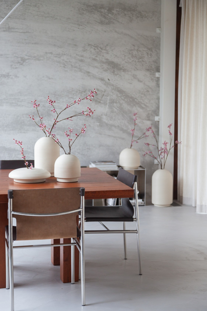 Table with ribbed vases in natural colors