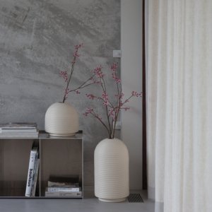 Table with ribbed vases in natural colors
