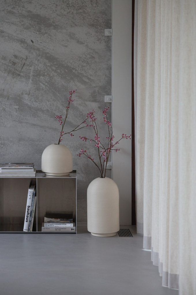 Table with ribbed vases in natural colors