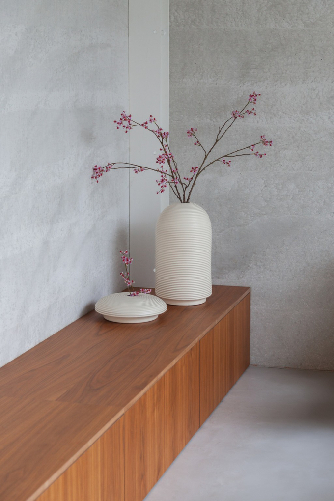 Table with ribbed vases in natural colors